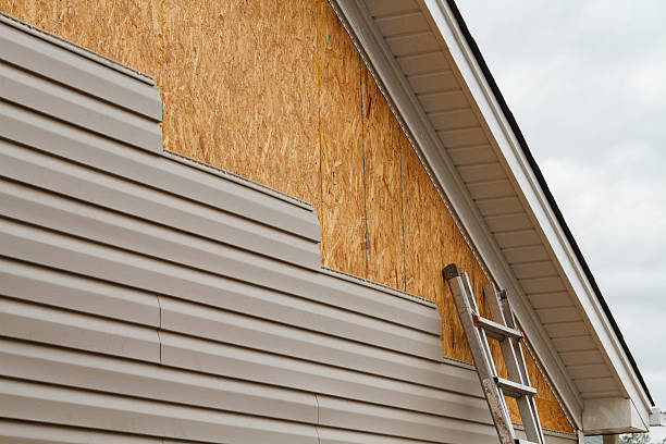 Professional Siding technician working in McGrady, NC